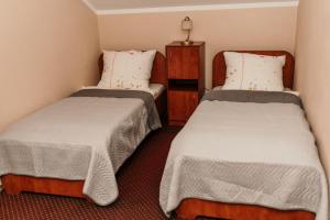 Ένα ή περισσότερα κρεβάτια σε δωμάτιο στο Motel Łasuch