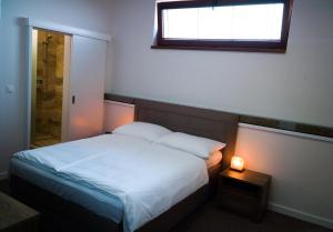 Postel nebo postele na pokoji v ubytování A7 Apartments
