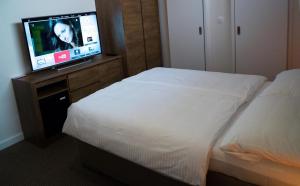 Postel nebo postele na pokoji v ubytování A7 Apartments