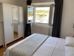 Postel nebo postele na pokoji v ubytování Apartments Barbaresko