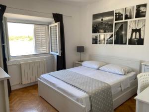 Postel nebo postele na pokoji v ubytování Apartments Barbaresko