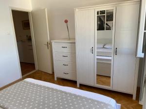 Postel nebo postele na pokoji v ubytování Apartments Barbaresko