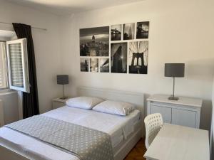 Postel nebo postele na pokoji v ubytování Apartments Barbaresko