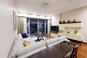 a living room with a couch and a table at Moscow City Apartment Luxury Апартаменты Москва Сити 48-75 floors in Moscow