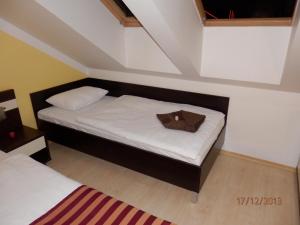 
Posteľ alebo postele v izbe v ubytovaní Free Apartman Besenova
