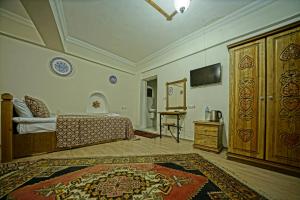 TV a/nebo společenská místnost v ubytování Göreme Art Stone