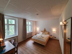 Postel nebo postele na pokoji v ubytování Waldhotel am See Berlin-Schmöckwitz