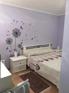 Ένα ή περισσότερα κρεβάτια σε δωμάτιο στο Il Casale di Lavinia