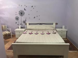 a bedroom with a bed with pink shoes on it at Il Casale di Lavinia in Fabro