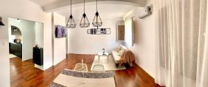 a living room with a couch and a table at Les Falaises in 'Aïn Taya