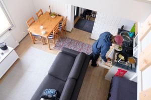 an overhead view of a woman in a living room at Lucky Ranch cabin 4 in Pyhätunturi