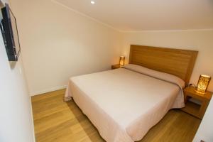 Postel nebo postele na pokoji v ubytování Hotel Cesario