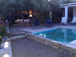 a swimming pool in the backyard of a house at Casa Margot in Cadaqués