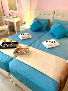 Voodi või voodid majutusasutuse Palotel Design Gouvia toas