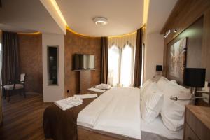 Voodi või voodid majutusasutuse Hotel Vrbak ND toas