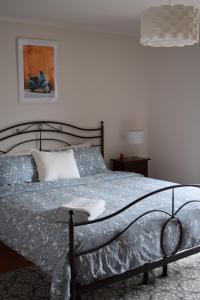 Postel nebo postele na pokoji v ubytování Casa Langhe di Mango - Barolo