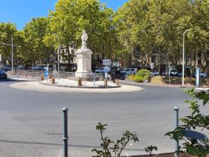 a statue in the middle of a street at APPARTEMENT AGATHOIS-2 in Agde