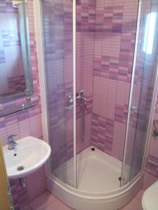 a bathroom with a shower and a sink at Apartments Angie in Biograd na Moru +31 photos