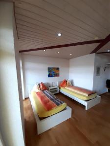 a room with two beds in a room with at Hotel Pamakin in Wynau