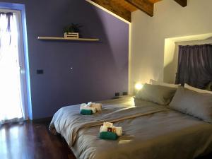 Postel nebo postele na pokoji v ubytování Al Chiar di Luna B&B Valtellina