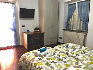 Postel nebo postele na pokoji v ubytování Al Chiar di Luna B&B Valtellina