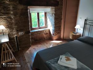 A bed or beds in a room at Albergue Atrio