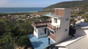 a house with a view of the ocean at Refúgio Vista Mar Praia da Gamboa - SC in Garopaba