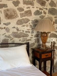 Ένα ή περισσότερα κρεβάτια σε δωμάτιο στο VERANDA BLUE - POROS