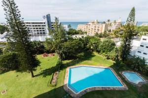 an overhead view of a large swimming pool in a park at La Ballito 402 in Ballito +2 photos