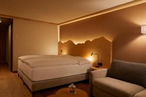 Rúm í herbergi á Hotel Alpenland