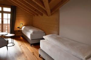 Rúm í herbergi á Hotel Alpenland