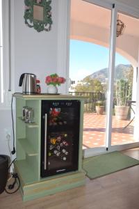 a kitchen with an oven with a sliding glass door at Casa Ancladero Room W big balcony and lovely view in Fuengirola