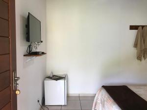 TV a/nebo společenská místnost v ubytování Pouso Familiar - Cantinho das Águas + 9 fotografií