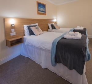 En eller flere senge i et værelse på Bracarina House Bed & Breakfast & Caledonian Studio