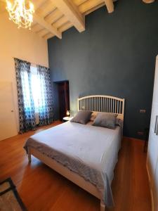 מיטה או מיטות בחדר ב-Appartamento in Palazzo Bucelli