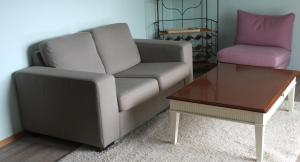 a living room with a couch and a coffee table at wohnung oben Steiger in Bad Birnbach