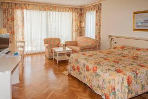Postel nebo postele na pokoji v ubytování Hotel Miramar