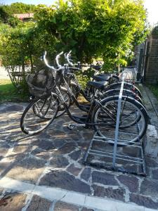 two bikes parked next to each other on a stone sidewalk at Casa Pianta in Cavallino-Treporti