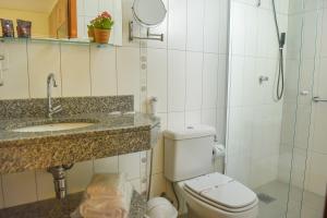 
Um banheiro em Residencial Flat Villa Rosa
