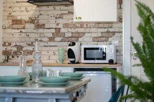 Una cocina o zona de cocina en Alojamientos Teatro
