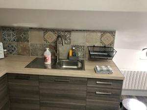 a kitchen with a sink and a counter top at Casa SM in Mennecy