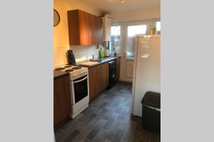 Η κουζίνα ή μικρή κουζίνα στο Newton Aycliffe Contractors Accommodation +2 φωτογραφίες