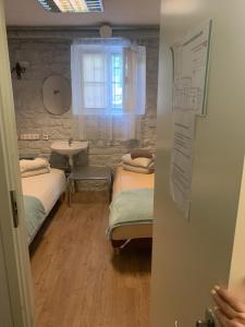 Postel nebo postele na pokoji v ubytování Süda Hostel