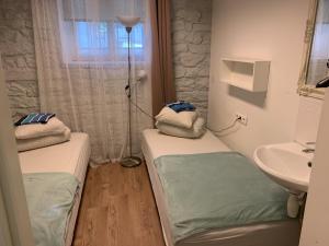 Postel nebo postele na pokoji v ubytování Süda Hostel