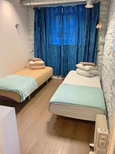 Postel nebo postele na pokoji v ubytování Süda Hostel