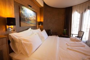 Voodi või voodid majutusasutuse Hotel Vrbak ND toas