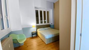 Кровать или кровати в номере BNB Capital Milano Central Station - Green