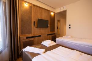 Voodi või voodid majutusasutuse Hotel Vrbak ND toas