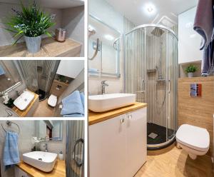 bagno con doccia, lavandino e servizi igienici di Apartament LILA a Łódź