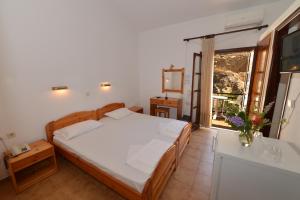 Кровать или кровати в номере Ikaros Star Hotel
